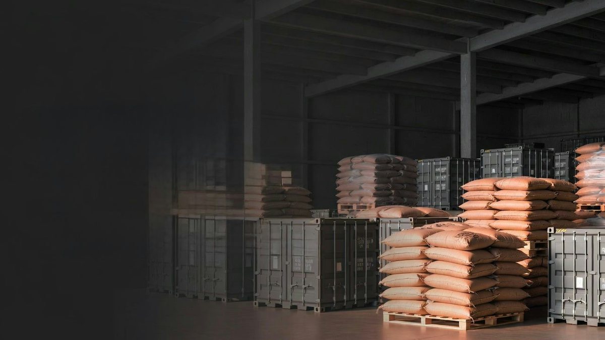 Sacks of produce stacked on pallets in a warehouse